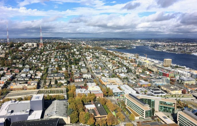 an aerial view of a city and the ocean
